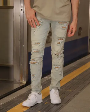 Distressed Ripped Blue Jeans with Vintage Charm
