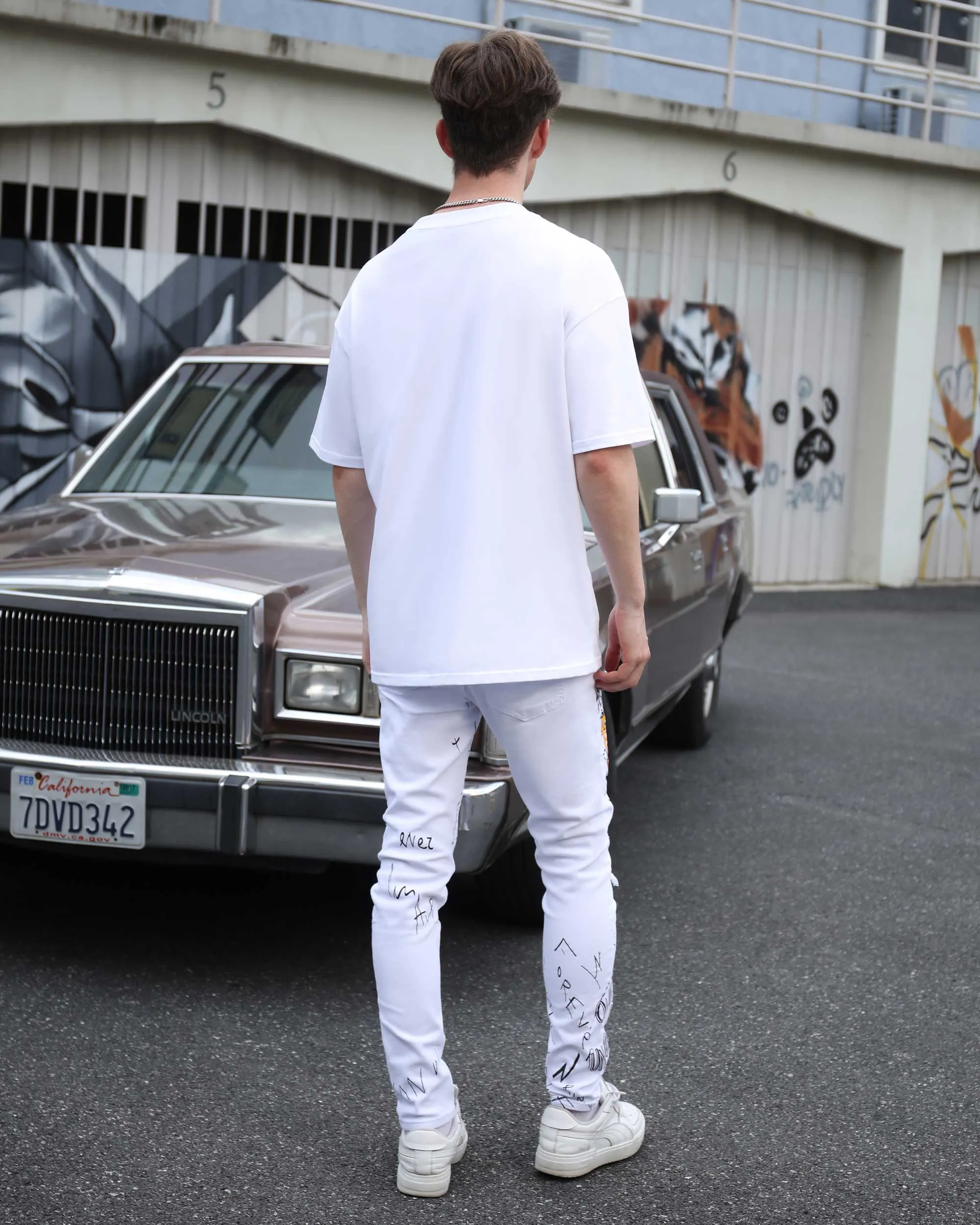 White Ripped Jeans with Colorful Graffiti and Embroidery